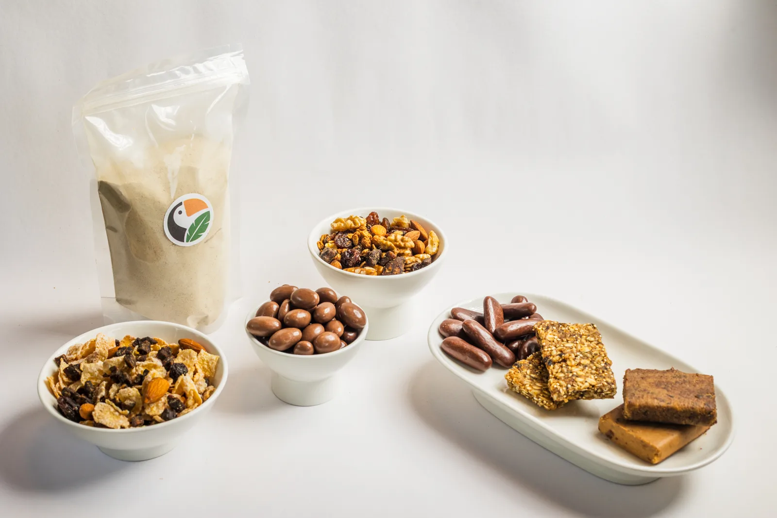 Granola, trail mix, chocolate-coated fruit and bars made with PEBSA ingredients